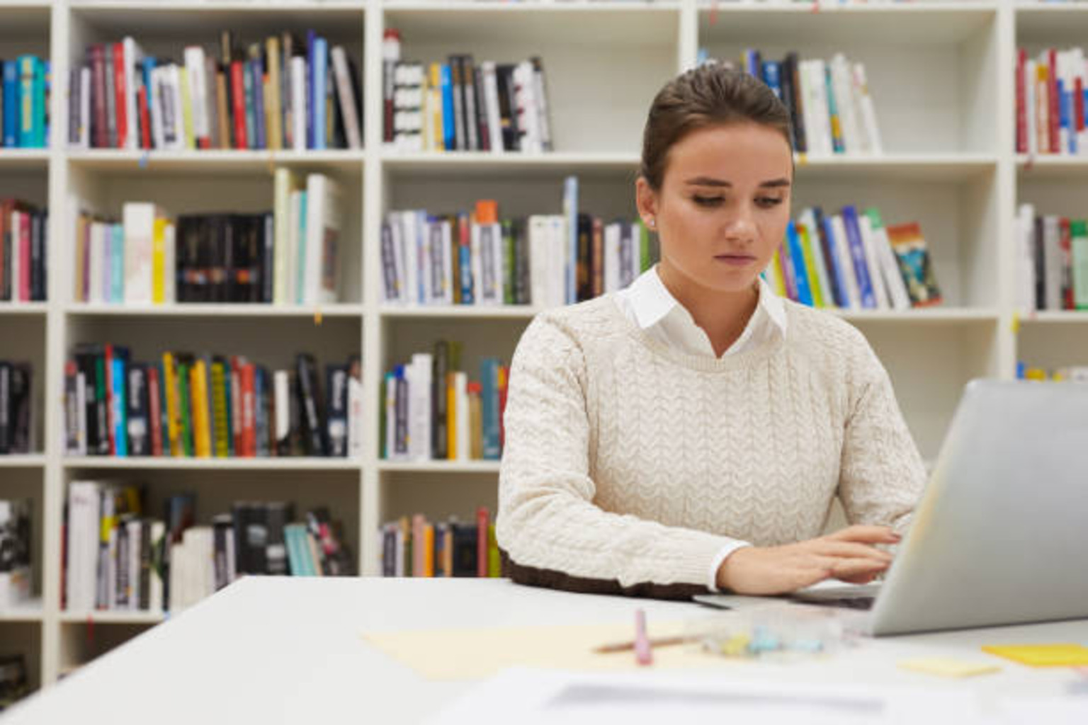 Student using laptop studying PTE Exam